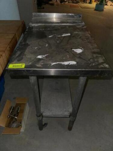 DESCRIPTION 18" X 30" STAINLESS TABLE W/ BACK SPLASH SIZE 18" X 30" LOCATION SECOND BUILDING QTY 1