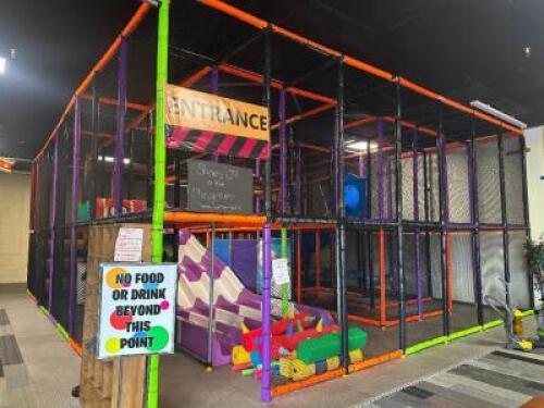 40' X 30' TWO-STORY INDOOR SOFT PLAY STRUCTURE COMMERCIAL GRADE CLIMBING GYM FEATURING A MULTI-LEVEL DESIGN WITH INTEGRATED SLIDES, RAMPS, PADDED PLATFORMS, AND SAFETY NETTING THROUGHOUT. CONSTRUCTED WITH POWDER-COATED STEEL FRAME, VINYL-COVERED SOFT FOA