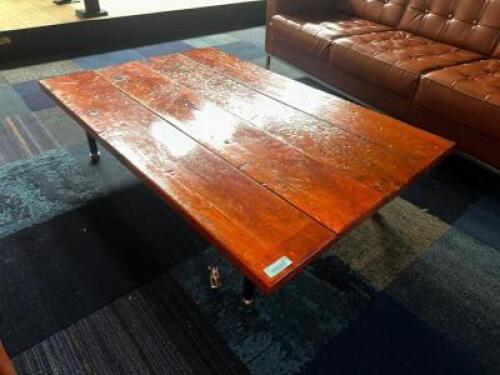 5' X 3' HARDWOOD COFFEE TABLE W/ DARK ORANGE FINISH.