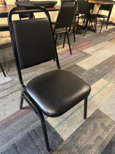 (16) BLACK PADDED STACK CHAIRS.
