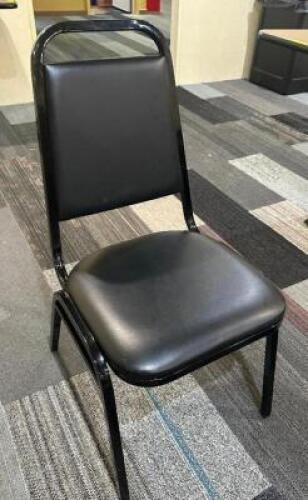 (8) BLACK PADDED STACK CHAIRS.