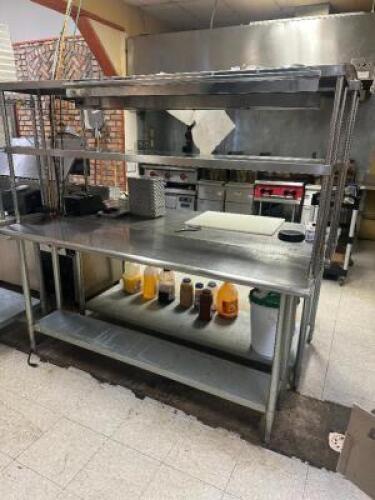 DESCRIPTION 72" X 24" STAINLESS TABLE W/ TWO TIER RISER SHELF. ADDITIONAL INFORMATION W/ TICKET RAIL SIZE 72" X 24" LOCATION KITCHEN QTY 1