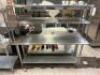 DESCRIPTION 72" X 24" STAINLESS TABLE W/ TWO TIER RISER SHELF. ADDITIONAL INFORMATION W/ TICKET RAIL SIZE 72" X 24" LOCATION KITCHEN QTY 1 - 3
