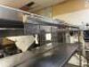 DESCRIPTION 72" X 24" STAINLESS TABLE W/ TWO TIER RISER SHELF. ADDITIONAL INFORMATION W/ TICKET RAIL SIZE 72" X 24" LOCATION KITCHEN QTY 1 - 4