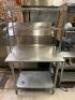 DESCRIPTION 36" X 30" STAINLESS TABLE W/ TWO TIER WIRE RISER SHELF. LOCATION KITCHEN QTY 1