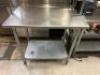 DESCRIPTION 36" X 30" STAINLESS TABLE W/ TWO TIER WIRE RISER SHELF. LOCATION KITCHEN QTY 1 - 3