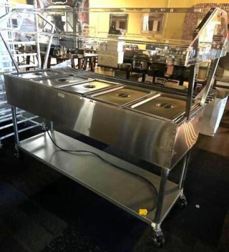 DESCRIPTION 2023 SERVIT 5 WELL STAINLESS STEAM TABLE BUFFET W/ SNEEZE GUARD BRAND / MODEL: SERVIT 423EST5WO ADDITIONAL INFORMATION 208 VOLT. RETAILS F