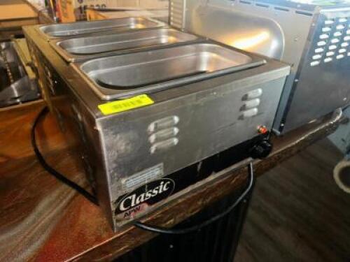 DESCRIPTION APW CLASSIC SINGLE WELL ELECTRIC WARMER. BRAND / MODEL: APW ADDITIONAL INFORMATION 115 VOLT, 1 PHASE. LOCATION BAR QTY 1