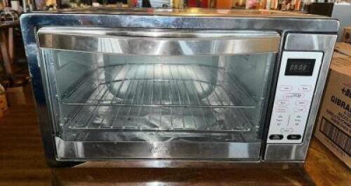 DESCRIPTION OSTER TOASTER OVEN. BRAND / MODEL: OYSTER TSSTTVDGXL LOCATION BAR QTY 1