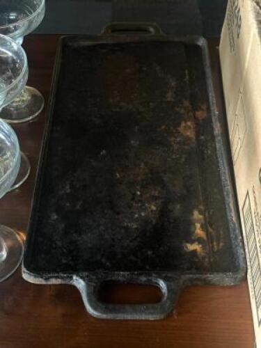 DESCRIPTION: CAST IRON GRIDDLE LOCATION: TABLES THIS LOT IS: ONE MONEY QTY: 1