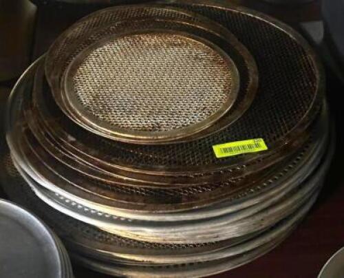 DESCRIPTION: LARGE GROUP OF WELL USED PIZZA PANS LOCATION: TABLES THIS LOT IS: ONE MONEY QTY: 1