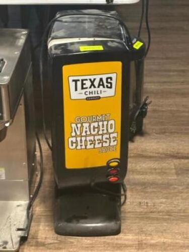 DESCRIPTION: NACHO CHEESE DISPENSER ADDITIONAL INFORMATION: NOT WORKING LOCATION: TABLES THIS LOT IS: ONE MONEY QTY: 1