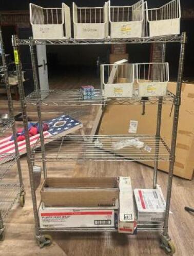 DESCRIPTION: ROLLING SHELVING UNIT ADDITIONAL INFORMATION: CONTENTS INCLUDED LOCATION: TABLES THIS LOT IS: ONE MONEY QTY: 1