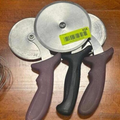 DESCRIPTION: (3) - PIZZA CUTTERS LOCATION: TABLES THIS LOT IS: SOLD BY THE PIECE QTY: 3