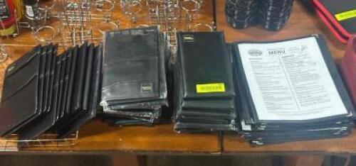 DESCRIPTION: LARGE GROUP OF MENUS AND CHECK FOLDERS LOCATION: TABLES THIS LOT IS: ONE MONEY QTY: 1