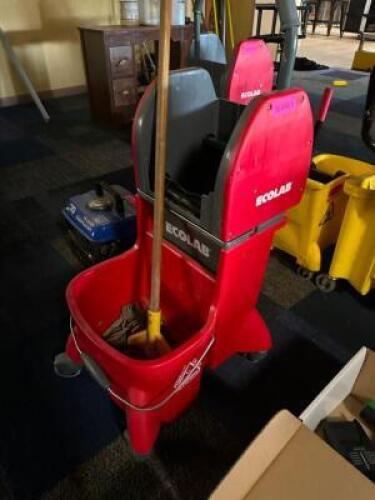 DESCRIPTION ECOLAB RED PLASTIC HEAVY DUTY MOP BUCKET W/ WRINGER BRAND / MODEL: ECOLAB LOCATION MAIN SEATING QTY 1