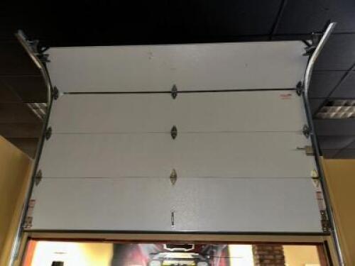 DESCRIPTION FOUR-PANEL 9'8" NON-POWERED GARAGE DOOR WITH RAILS ADDITIONAL INFORMATION TOOLS AND LABOR REQUIRED FOR REMOVAL LOCATION MAIN SEATING QTY 1