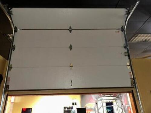 DESCRIPTION FOUR-PANEL 9'8" NON-POWERED GARAGE DOOR WITH RAILS ADDITIONAL INFORMATION TOOLS AND LABOR REQUIRED FOR REMOVAL LOCATION MAIN SEATING QTY 1