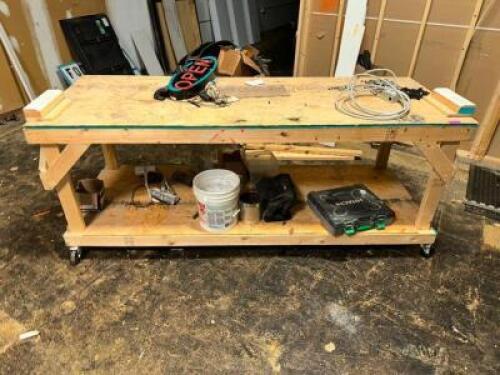 DESCRIPTION 8' CUSTOM BUILT WOODEN SHOP TABLE. ADDITIONAL INFORMATION ON CASTERS. SIZE 8' LOCATION WAREHOUSE QTY 1
