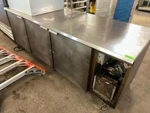 DESCRIPTION 7' THREE DOOR REFRIGERATED WORK TOP COOLER. ADDITIONAL INFORMATION MISSING COMPRESSOR PANEL. TESTED AND WORKING. COOLS GREAT LOCATION BAY