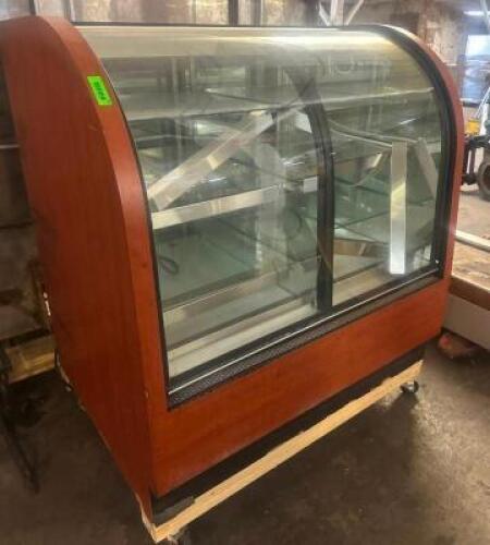 DESCRIPTION 48" DRY BAKER CASE W/ CURVED GLASS FRONT/ ADDITIONAL INFORMATION REFRIGERATION IS NOT WORKING. WAS USED FOR DRY DISPLAY. DOES HAVE LIGHTIN
