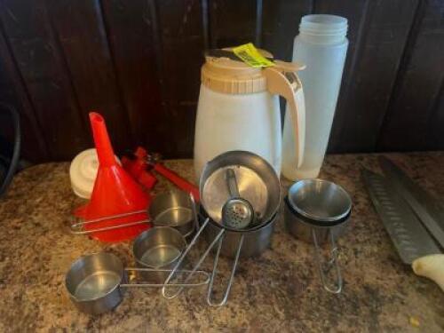 ASSORTED MEASURING CUPS AND SAUCE CONTAINERS
