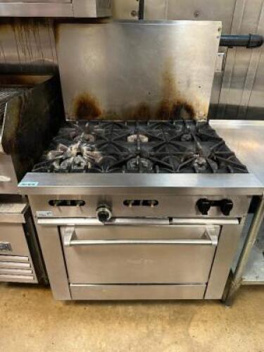DESCRIPTION SUNFIRE SIX BURNER GAS RANGE W/ LOWER CONVENTIONAL OVEN BRAND / MODEL: SUNFIRE ADDITIONAL INFORMATION NATURAL GAS. WAS ON AND AT FULL TEMP