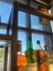 DESCRIPTION 9' THREE-SECTION CUSTOM METAL RACK WITH GLASS INSERT SHELVING, DESIGNED FOR BACK BAR BOTTLE DISPLAY. BUILT TO FIT AN 84" BACK BAR COOLER O - 5