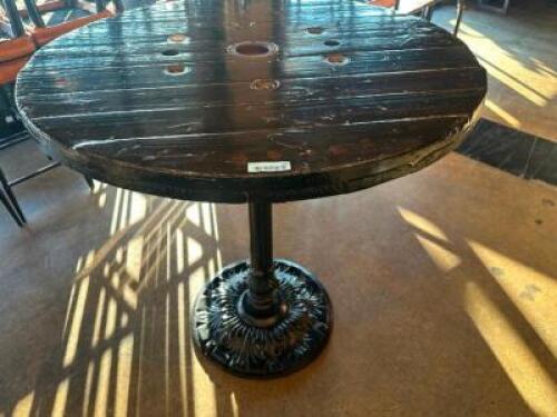 DESCRIPTION 44" ROUND PUB TABLE BUILT FROM WOODEN CABLE SPOOL WITH CAST IRON BASE ADDITIONAL INFORMATION RUSTIC PUB TABLE CRAFTED FROM A REPURPOSED WO