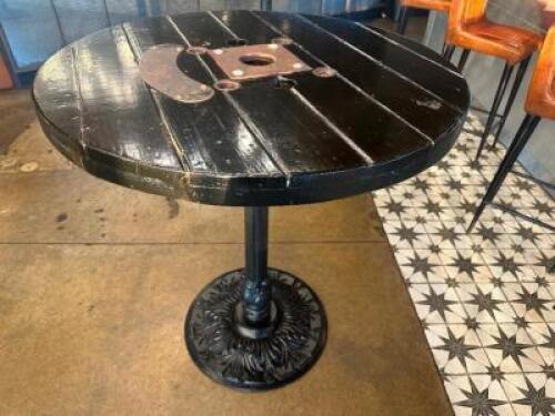 DESCRIPTION 44" ROUND PUB TABLE BUILT FROM WOODEN CABLE SPOOL WITH CAST IRON BASE ADDITIONAL INFORMATION RUSTIC PUB TABLE CRAFTED FROM A REPURPOSED WO