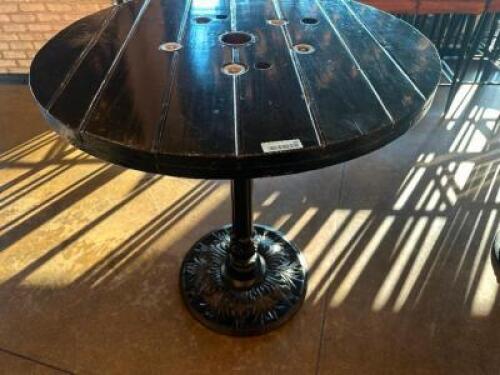 DESCRIPTION 44" ROUND PUB TABLE BUILT FROM WOODEN CABLE SPOOL WITH CAST IRON BASE ADDITIONAL INFORMATION RUSTIC PUB TABLE CRAFTED FROM A REPURPOSED WO