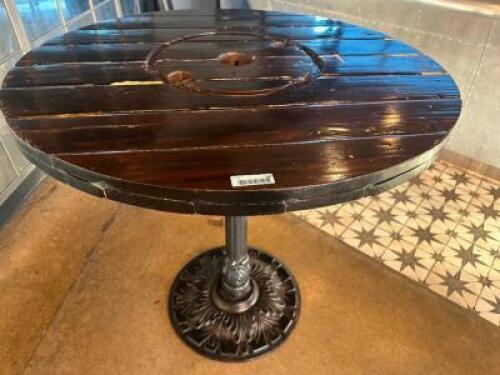DESCRIPTION 44" ROUND PUB TABLE BUILT FROM WOODEN CABLE SPOOL WITH CAST IRON BASE ADDITIONAL INFORMATION RUSTIC PUB TABLE CRAFTED FROM A REPURPOSED WO