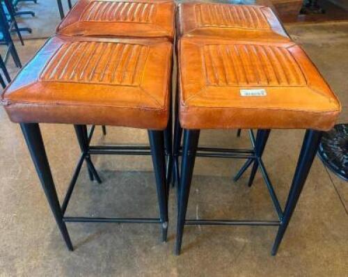DESCRIPTION (4) 18" X 18" COGNAC LEATHER BACKLESS BAR STOOLS. ADDITIONAL INFORMATION FAIR CONDITION W/ MORE WEAR AND TEAR ON THESE FOUR. THIS LOT IS:
