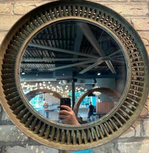 DESCRIPTION 21" JET ENGINE HOUSING WALL MIRROR. RETAILS FOR $600 ADDITIONAL INFORMATION STRIKING WALL MIRROR CRAFTED FROM A REPURPOSED JET ENGINE HOUS