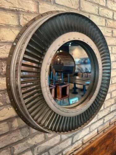 DESCRIPTION 28" JET ENGINE HOUSING WALL MIRROR. RETAILS FOR $800 ADDITIONAL INFORMATION STRIKING WALL MIRROR CRAFTED FROM A REPURPOSED JET ENGINE HOUS