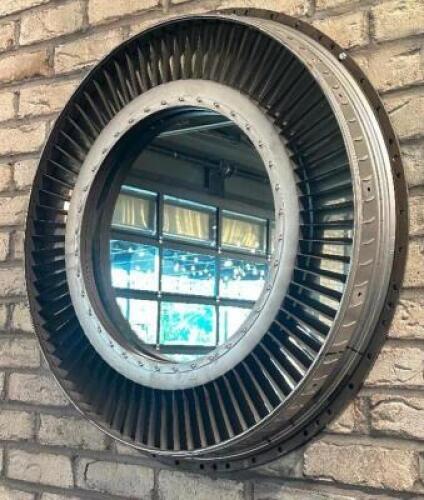 DESCRIPTION 28" JET ENGINE HOUSING WALL MIRROR. RETAILS FOR $700 ADDITIONAL INFORMATION STRIKING WALL MIRROR CRAFTED FROM A REPURPOSED JET ENGINE HOUS