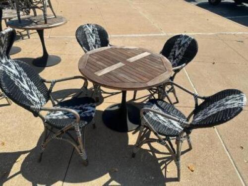DESCRIPTION 36" TEAK WOOD PATIO TABLE W/ (4) BLACK AND WHITE WOVEN COMPOSITE CHAIRS, SIZE 36" LOCATION PATIO QTY 1