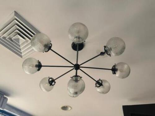 DESCRIPTION MID CENTURY MODERN 9 RIBBED GLASS GLOBE CHANDELIER. RETAILS FOR $550 ADDITIONAL INFORMATION WINNING BIDDER MUST WIRE CAP AFTER REMOVAL OR