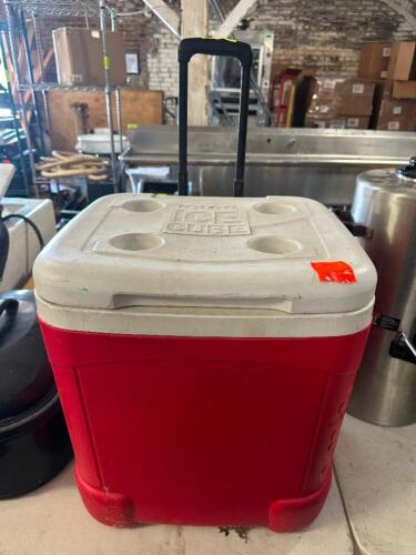ROLL ABOUT RED AND WHITE PLASTIC COOLER.