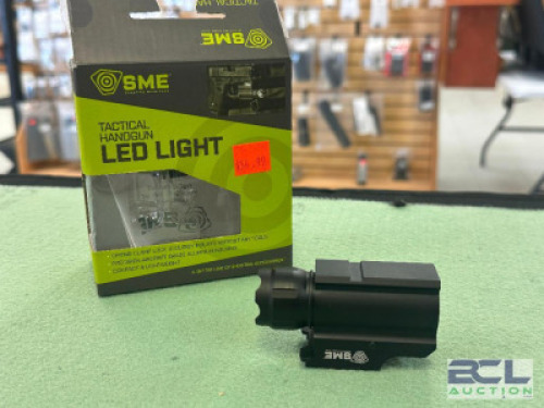 DESCRIPTION HANDGUN TAC LIGHT BRAND / MODEL: SME SIZE OPTICS COUNTER LOCATION ONE MONEY QTY 1