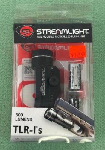 DESCRIPTION RAIL MOUNTED TAC FLASHLIGHT BRAND / MODEL: STREAMLIGHT SIZE OPTICS COUNTER LOCATION ONE MONEY QTY 1