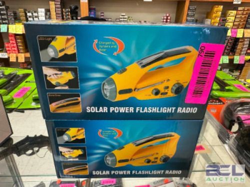DESCRIPTION (2) HAND WINDING CHARGE FLASH LIGHT RADIOS ADDITIONAL INFORMATION RETAIL FOR $48 EACH THIS LOT IS: SOLD BY THE PIECE LOCATION GUN COUNTER