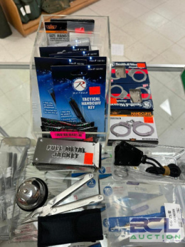 DESCRIPTION (1) LOT OF HANDCUFF KEYS, HANDCUFFS, AND MISC UTILITY KNIVES. THIS LOT IS: ONE MONEY LOCATION KNIFE COUNTER QTY 1