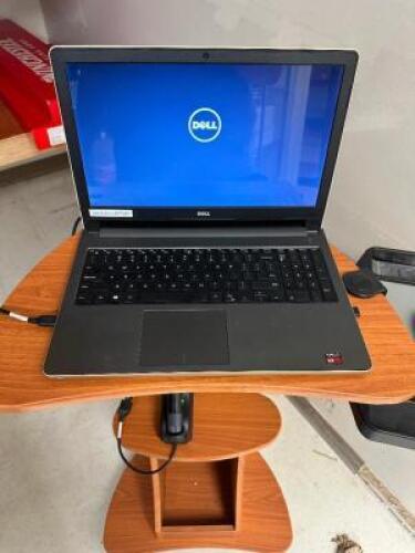DESCRIPTION DELL LAPTOP COMPUTER W/ ROLL ABOUT STAND. ADDITIONAL INFORMATION COMES WITH PASS CODE. COMPUTERS WILL BE WIPED BEFORE SALE. LOCATION BACK