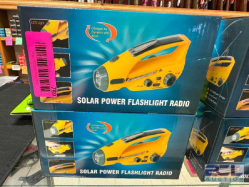 DESCRIPTION (2) HAND WINDING CHARGE FLASH LIGHT RADIOS ADDITIONAL INFORMATION RETAIL FOR $48 EACH THIS LOT IS: SOLD BY THE PIECE LOCATION GUN COUNTER