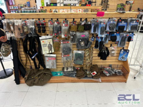 DESCRIPTION CONTENTS OF SHELF - ASSORTED MILITARY SURPLUS GEAR, PONCHO, BAGS, AND STRAPS. THIS LOT IS: ONE MONEY LOCATION MIDDLE FLOOR QTY 1