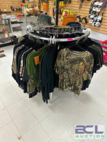 DESCRIPTION (1) LOT OF ASSORTED LOGO T SHIRTS. POLICE, SHERIF, POLITICAL, AND PLAIN. ADDITIONAL INFORMATION W/ RACK CRICLE STYLE HANGING CLOTHING RACK