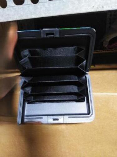 DESCRIPTION: (1) CASE OF APPROX (50) METAL WALLETS BRAND/MODEL: ARMORED WALLET INFORMATION: MANY DESIGNS QTY: 1