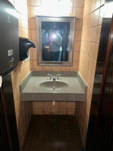 CONTENTS OF ENS BATHROOM. CHANGING STATION, URINAL, (3) TOILETS, TWO VANITY SINKS
