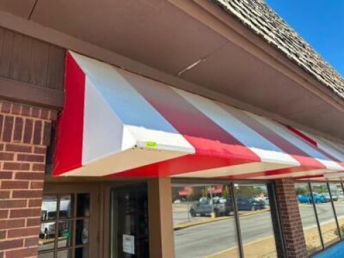 12' ALUMINUM FRAME AWNING IN RED AND WHITE STIPE VINYL WITH INTERNAL BACK LIGHTING.